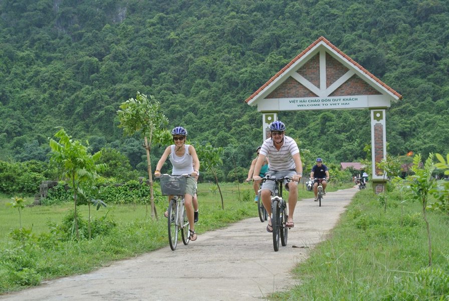 Tourists cycling to Viet Hai village 
